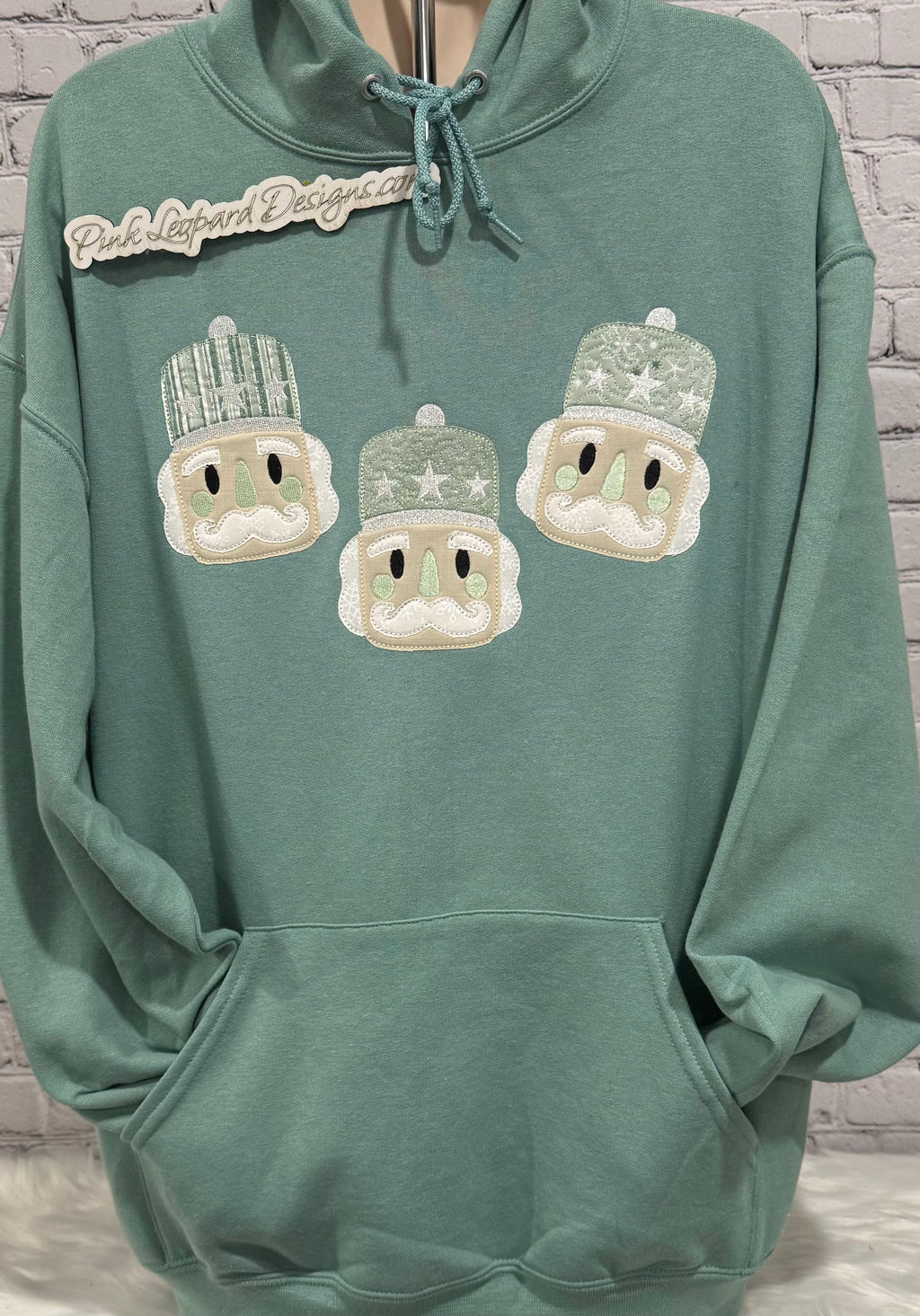 Pale Teal Nutcracker Appliqued Hooded Sweatshirt-Embroidered