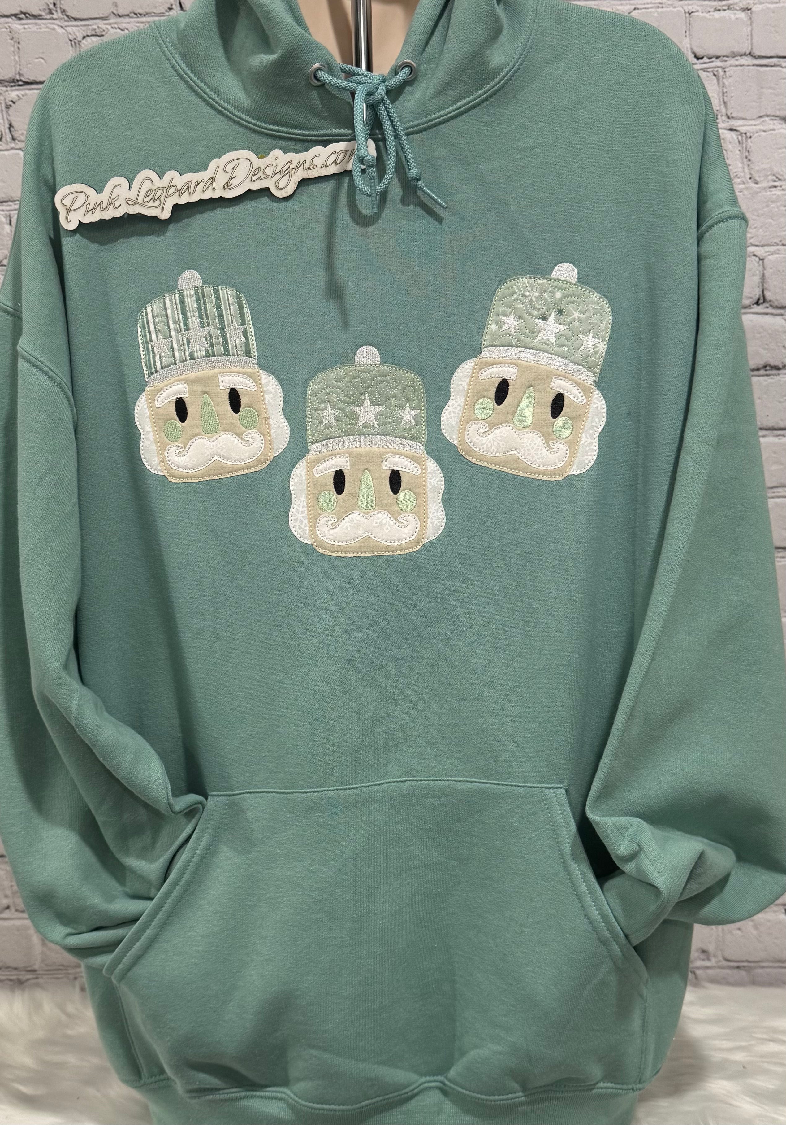 Pale Teal Nutcracker Appliqued Hooded Sweatshirt-Embroidered
